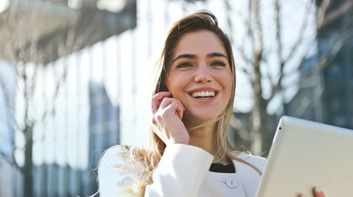 Woman In White Blazer Holding Tablet Computer 789822 (1)